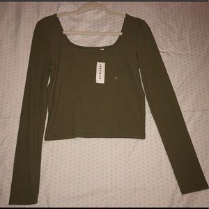 a green, square neck , ribbed long sleeve shirt